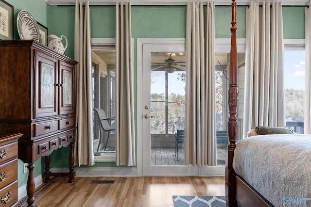 bedroom featuring light hardwood / wood-style floors and access to outside