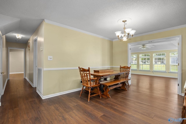 dining area with ornamental molding, dark hardwood / wood-style flooring, and a textured ceiling