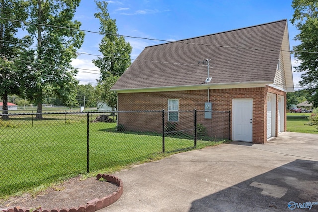 view of property exterior with a yard and a garage