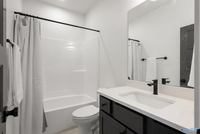 bathroom with toilet, vanity, and shower / bath combo with shower curtain