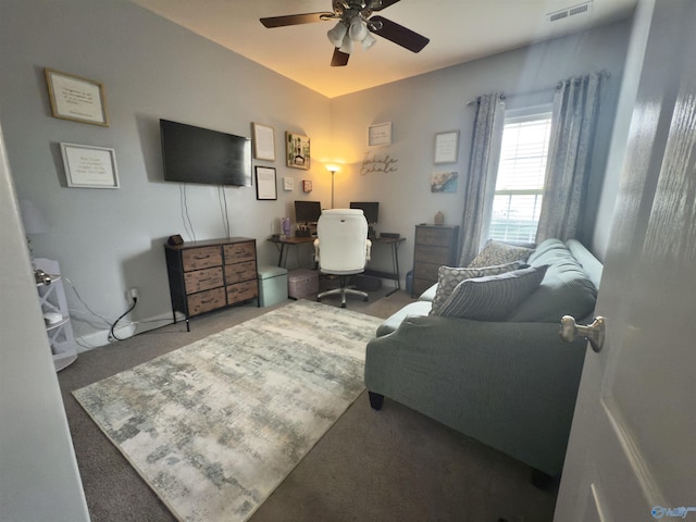 carpeted office featuring ceiling fan, visible vents, and baseboards