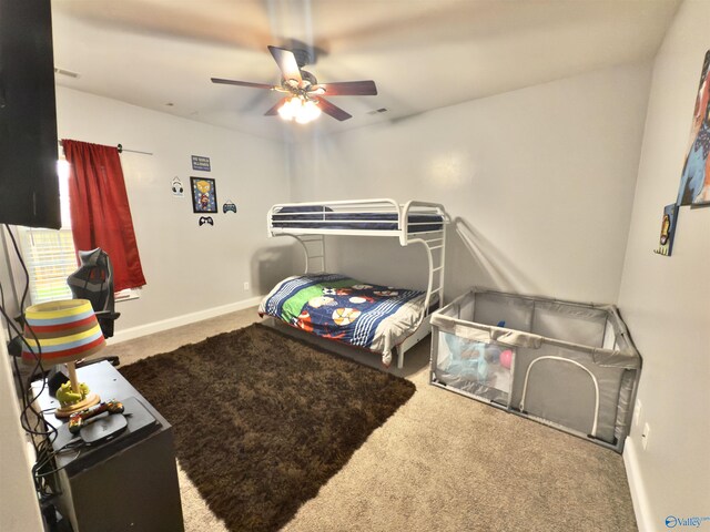 bedroom featuring a ceiling fan, carpet flooring, and baseboards