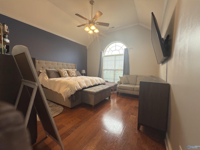 bedroom featuring dark wood finished floors, ceiling fan, crown molding, and lofted ceiling