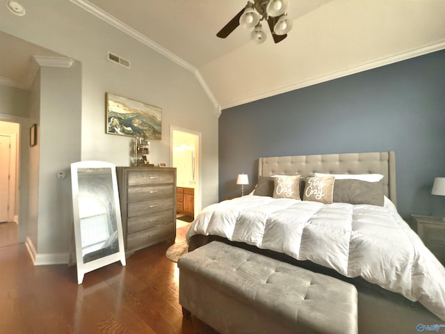 bedroom with lofted ceiling, crown molding, visible vents, baseboards, and wood finished floors