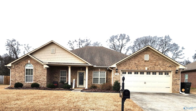 view of front of home with brick siding, a shingled roof, an attached garage, driveway, and a front lawn