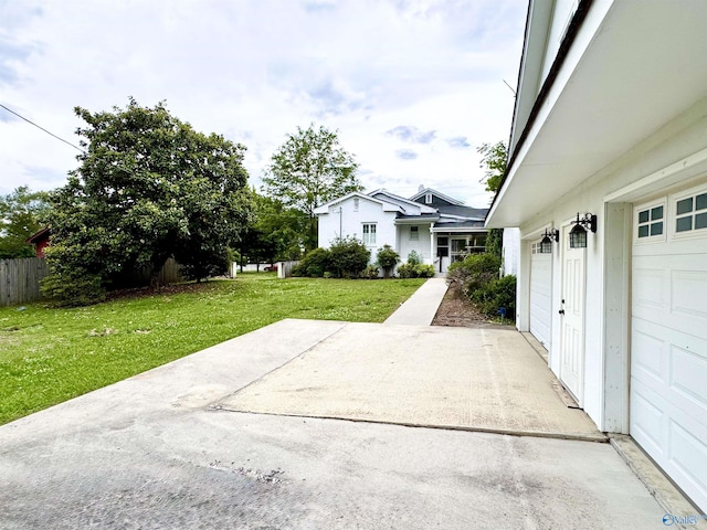 102 Jackson St, Albertville, AL 35950 - view of grassy yard featuring a patio area and a garage