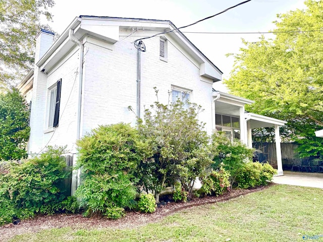 102 Jackson St, Albertville, AL 35950 - view of side of property with a chimney