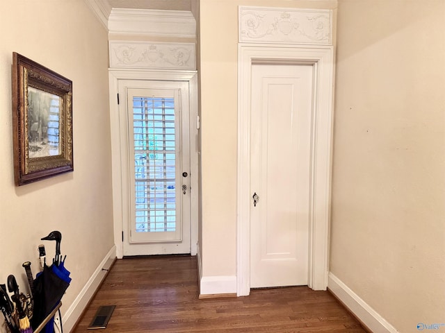 102 Jackson St, Albertville, AL 35950 - foyer featuring ornamental molding, baseboards, and dark wood-type flooring