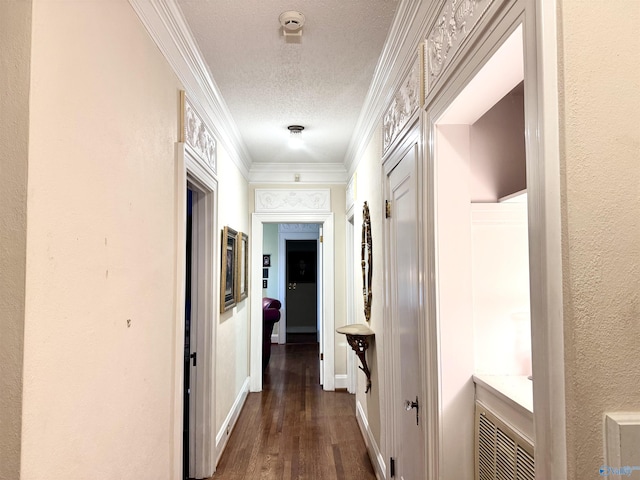102 Jackson St, Albertville, AL 35950 - corridor featuring dark wood-type flooring, ornamental molding, and a textured ceiling