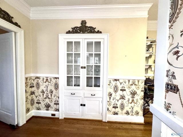 102 Jackson St, Albertville, AL 35950 - detailed view of ornamental molding, wood finished floors, wallpapered walls, and a wainscoted wall