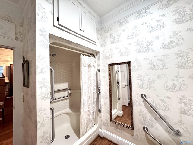102 Jackson St, Albertville, AL 35950 - full bath featuring wood finished floors, a shower with shower curtain, baseboards, wallpapered walls, and ornamental molding