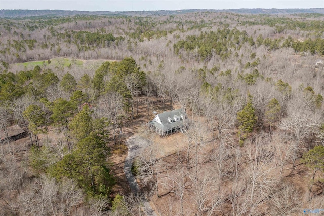 drone / aerial view featuring a forest view