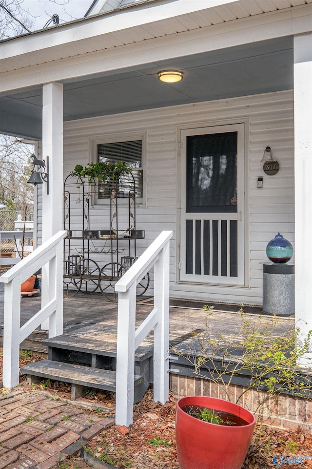 property entrance with covered porch