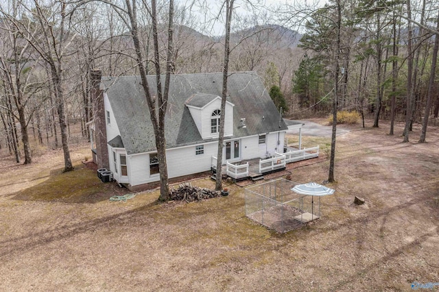 birds eye view of property with a mountain view