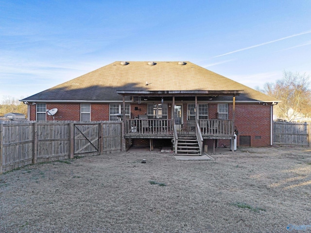 back of house featuring a deck