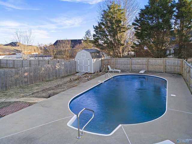 view of pool featuring a storage unit and a diving board