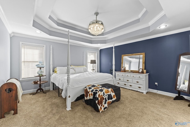 carpeted bedroom with crown molding, a raised ceiling, and a notable chandelier