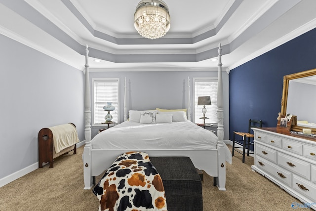 bedroom with crown molding, a tray ceiling, a chandelier, and light carpet