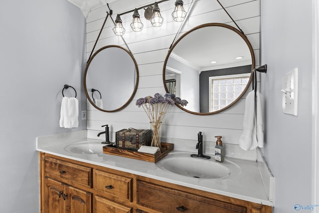 bathroom featuring vanity and ornamental molding