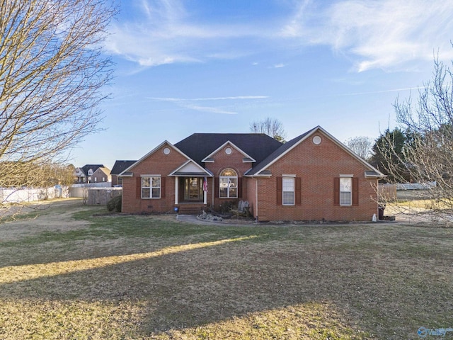 ranch-style house featuring a front lawn