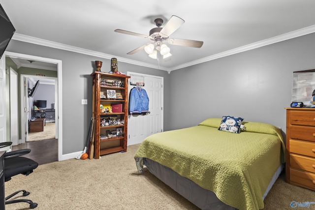 bedroom featuring ornamental molding, ceiling fan, and carpet