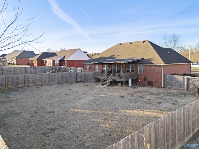 rear view of house featuring a deck