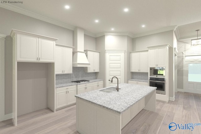 kitchen featuring light stone countertops, light wood-type flooring, white cabinetry, and sink