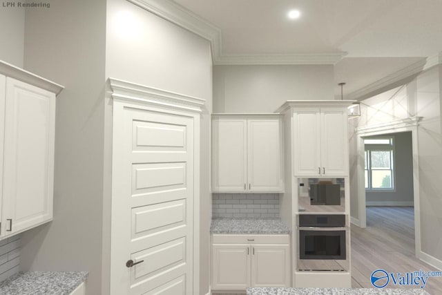 kitchen with white cabinets, decorative backsplash, light hardwood / wood-style flooring, and oven