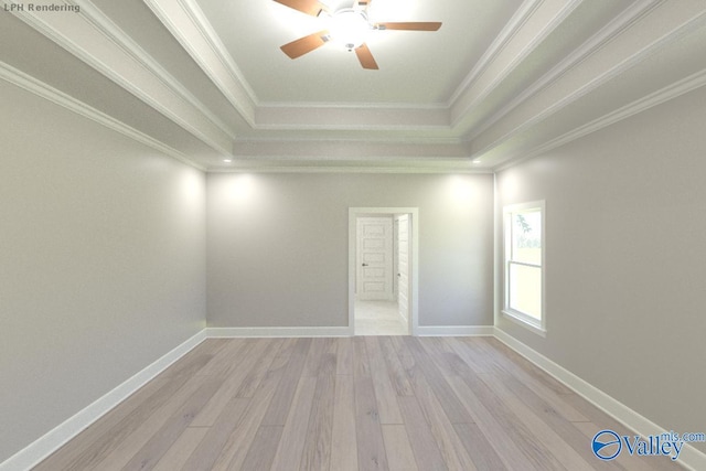 spare room featuring a tray ceiling, crown molding, light hardwood / wood-style flooring, and ceiling fan