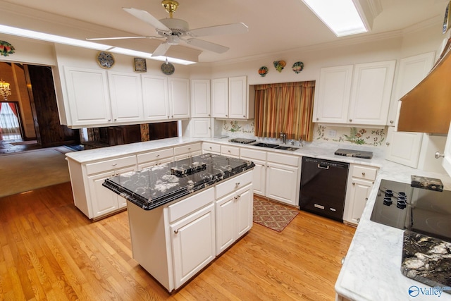 kitchen featuring white cabinetry, dishwasher, a kitchen island, and light wood-type flooring