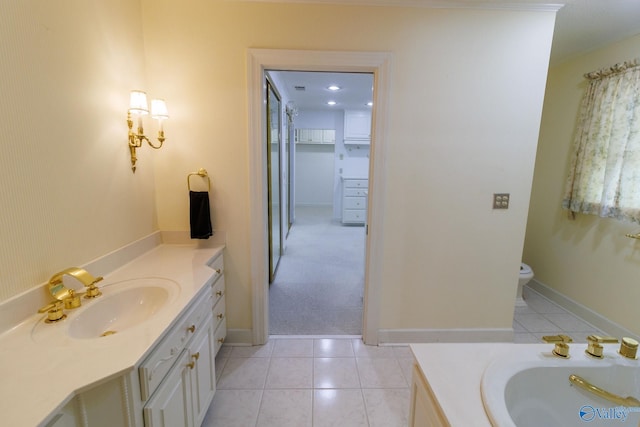 bathroom with vanity, tile patterned flooring, and toilet