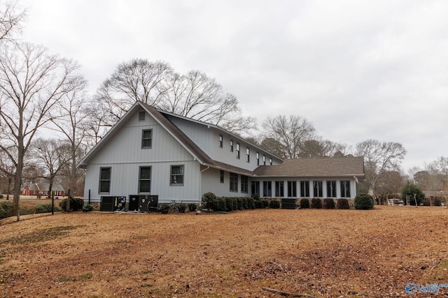 rear view of house with central AC unit