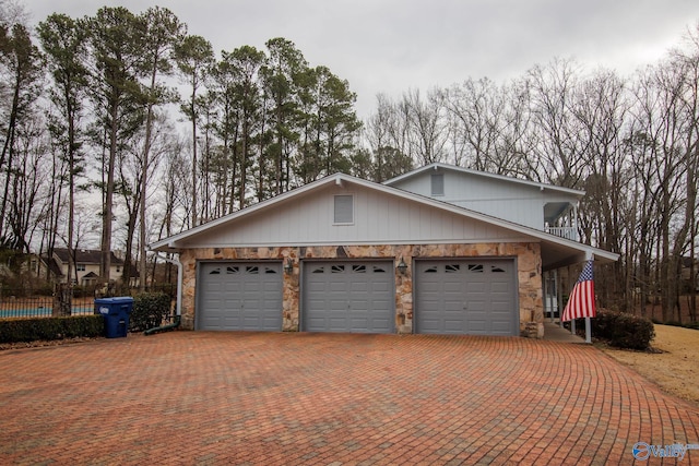 view of side of home featuring a garage