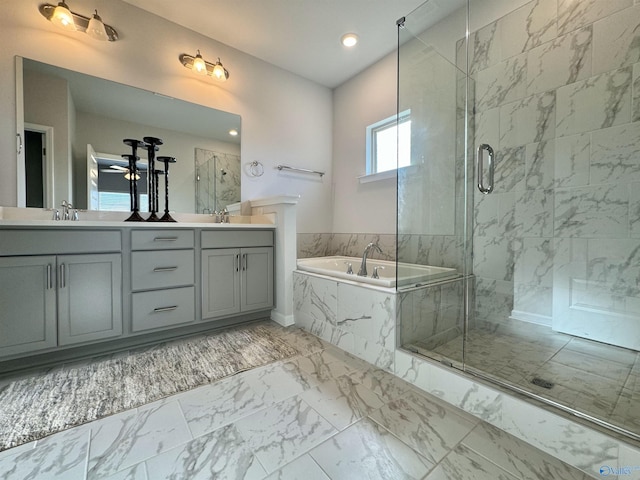 full bath with a marble finish shower, marble finish floor, a sink, double vanity, and a bath