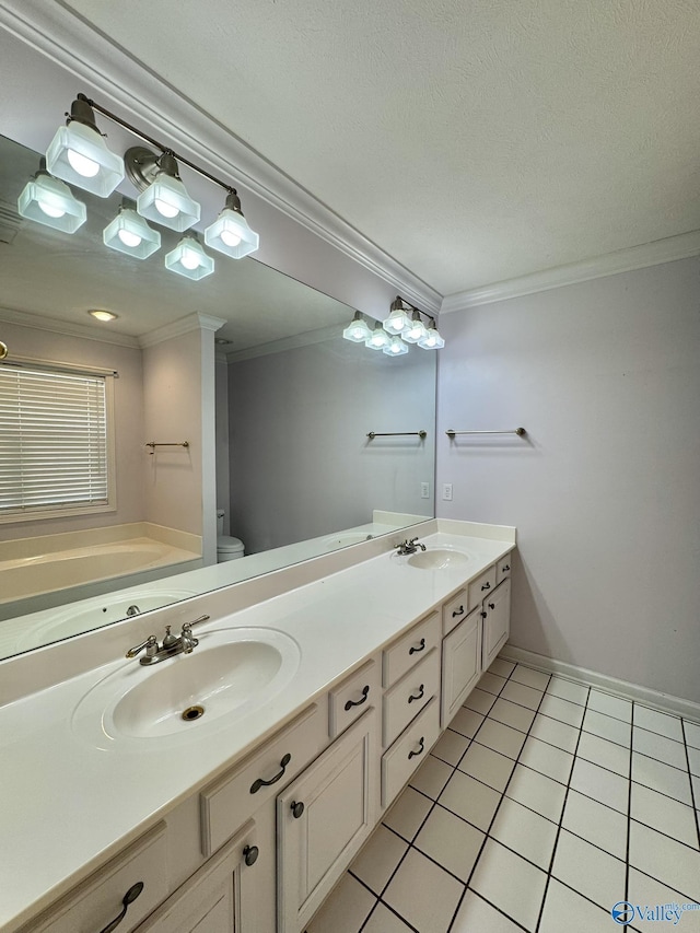 bathroom with ornamental molding, vanity, toilet, tile patterned floors, and a textured ceiling