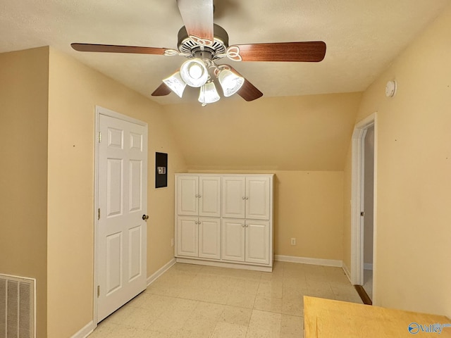 additional living space with vaulted ceiling and ceiling fan