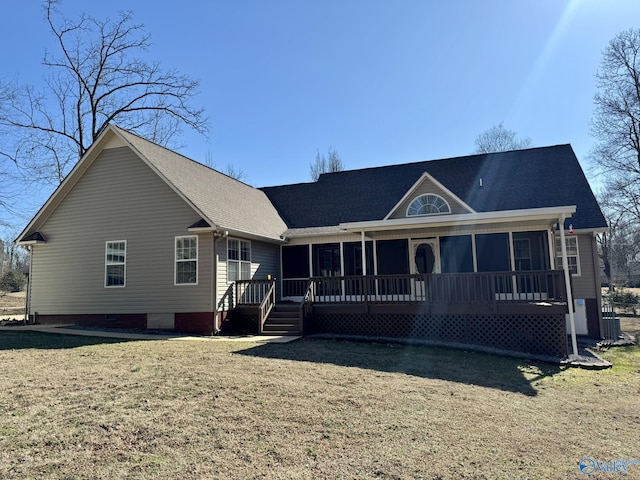 view of front facade featuring a sunroom and a front yard