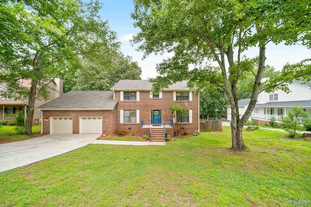2010 Burlington Dr SE, Huntsville, AL 35803 - colonial house featuring an attached garage, concrete driveway, brick siding, and a front lawn