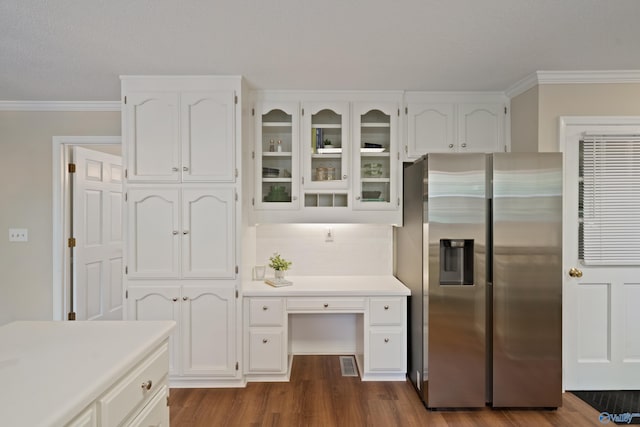 2010 Burlington Dr SE, Huntsville, AL 35803 - kitchen with stainless steel refrigerator with ice dispenser, white cabinetry, ornamental molding, light countertops, and decorative backsplash