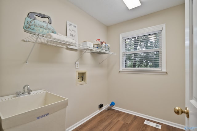 2010 Burlington Dr SE, Huntsville, AL 35803 - laundry room with hookup for a washing machine and dark wood-type flooring