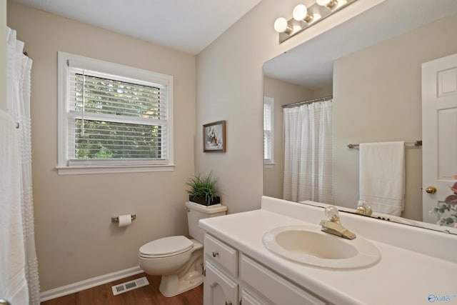 2010 Burlington Dr SE, Huntsville, AL 35803 - bathroom featuring wood finished floors, vanity, and a shower with shower curtain