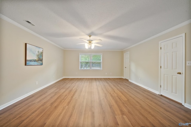 2010 Burlington Dr SE, Huntsville, AL 35803 - spare room with light wood-style floors, ceiling fan, crown molding, and a textured ceiling