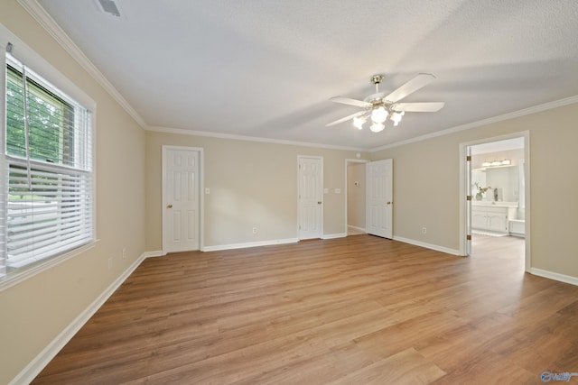 2010 Burlington Dr SE, Huntsville, AL 35803 - unfurnished bedroom featuring light wood-style floors, ornamental molding, ensuite bath, and ceiling fan