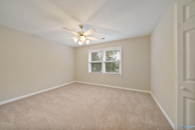 2010 Burlington Dr SE, Huntsville, AL 35803 - empty room with light carpet, a ceiling fan, and a textured ceiling