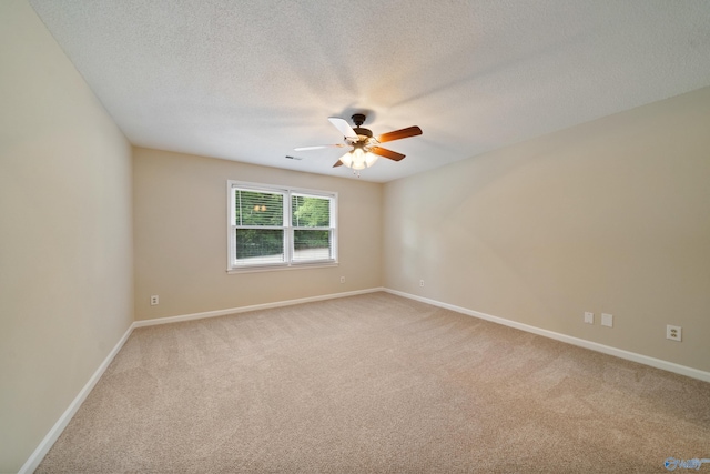 2010 Burlington Dr SE, Huntsville, AL 35803 - spare room with light carpet, a ceiling fan, and a textured ceiling