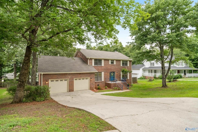 2010 Burlington Dr SE, Huntsville, AL 35803 - view of front of home with a garage, brick siding, concrete driveway, and a front lawn