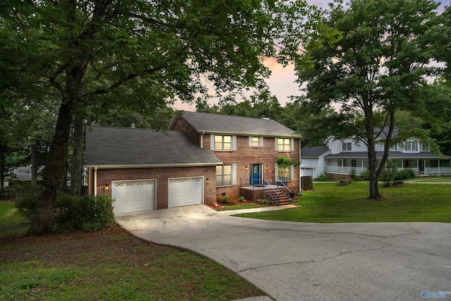 2010 Burlington Dr SE, Huntsville, AL 35803 - view of front of home with an attached garage, brick siding, concrete driveway, and a front lawn