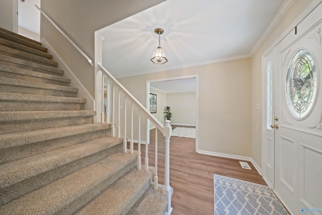 2010 Burlington Dr SE, Huntsville, AL 35803 - foyer with stairs, wood finished floors, and ornamental molding