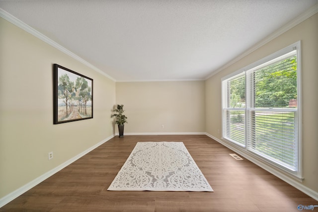2010 Burlington Dr SE, Huntsville, AL 35803 - spare room with dark wood-style floors and ornamental molding