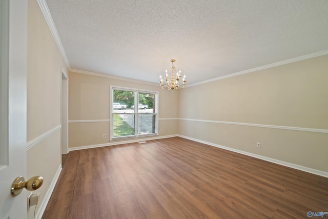 2010 Burlington Dr SE, Huntsville, AL 35803 - empty room with a chandelier, wood finished floors, a textured ceiling, and crown molding